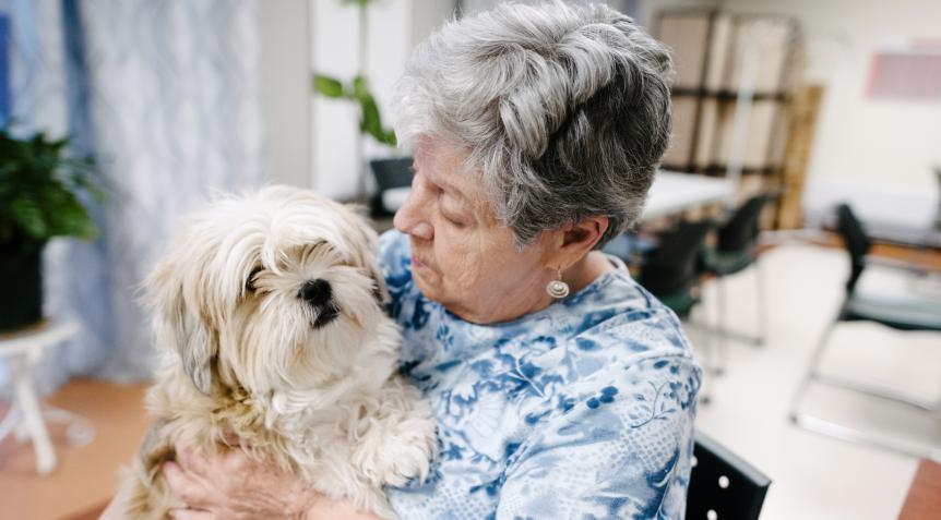 A resident and her dog at Lionel-Bourdon