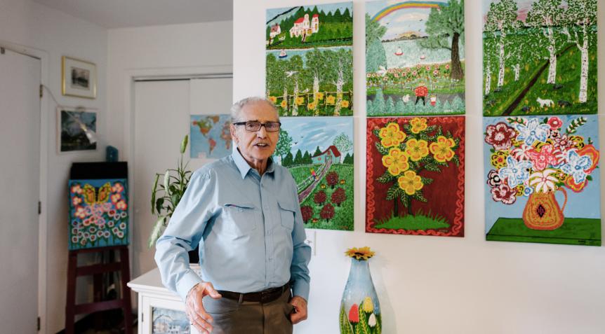 A resident with his artwork at Piero-Corti